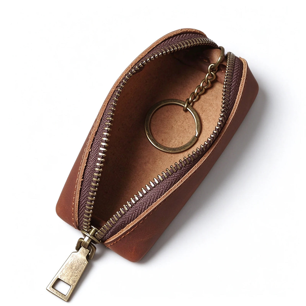 Open brown leather key pouch showing an internal key ring attached to a short metal chain.