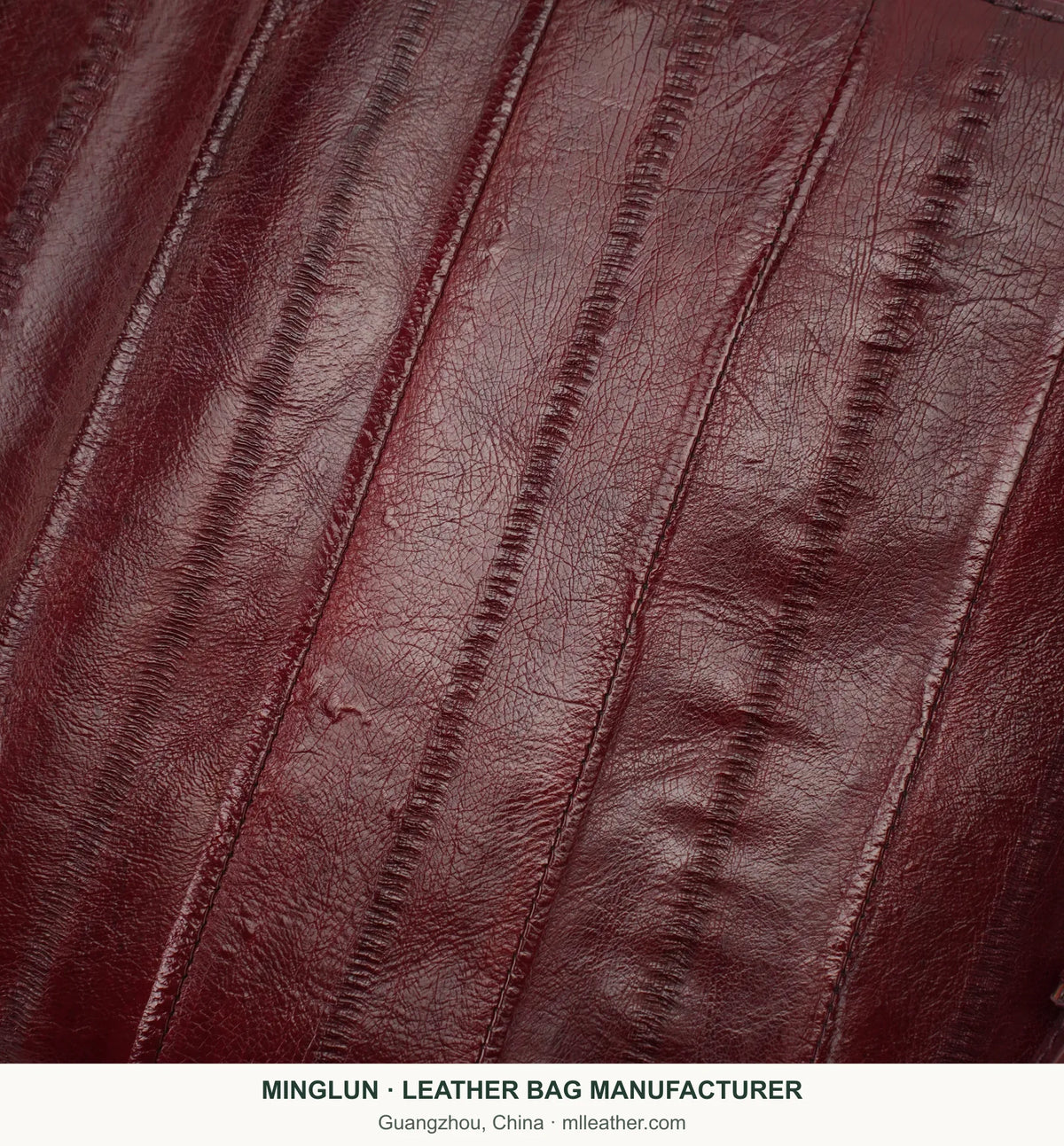 Close-up of burgundy eel leather panels and surface texture. MINGLUN manufacturer watermark at the bottom.