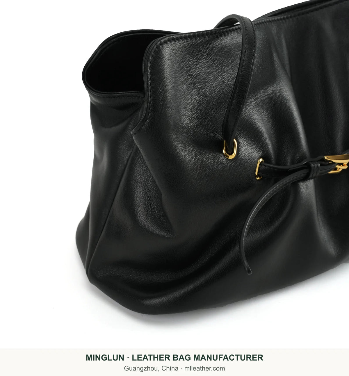 Gathered side and handle detail on black sheepskin tote bag. MINGLUN manufacturer watermark at the bottom.