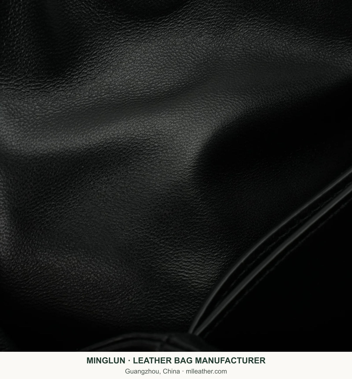 Black sheepskin texture detail on tote bag. MINGLUN manufacturer watermark at the bottom.