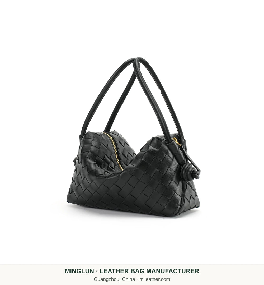 Black handwoven sheepskin shoulder bag, angled view. MINGLUN manufacturer watermark at the bottom.
