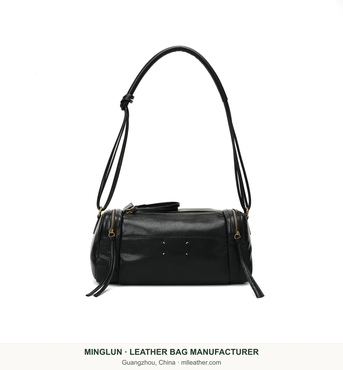 Black leather Boston shoulder bag with four white stitches, front view. MINGLUN manufacturer watermark at the bottom.