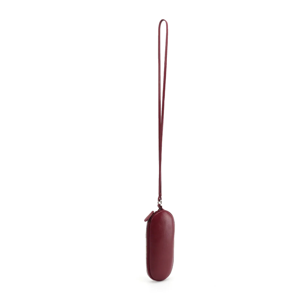 Angled view of a burgundy leather eyeglass pouch showing the zip edge and long strap