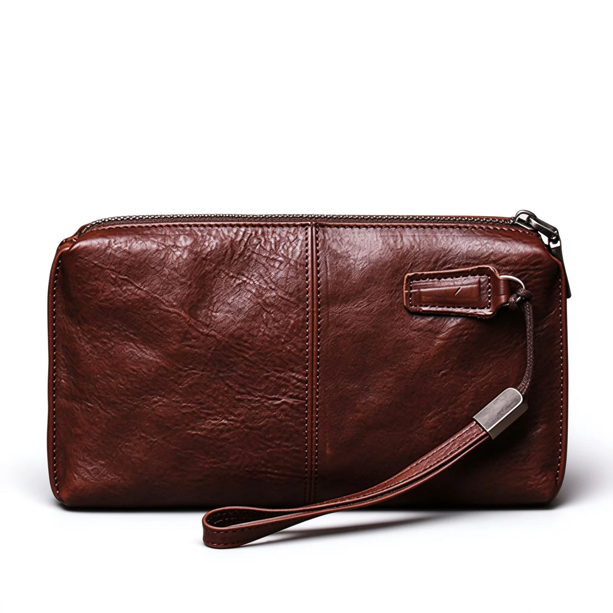 Reverse view of a red-brown leather wristlet showing the central seam and wrist-loop attachment