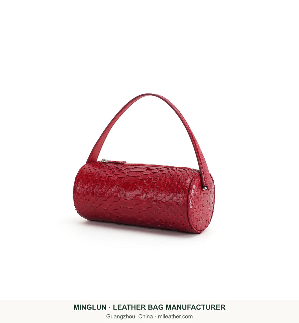 Red python leather barrel bag, three-quarter view. MINGLUN manufacturer watermark at the bottom.