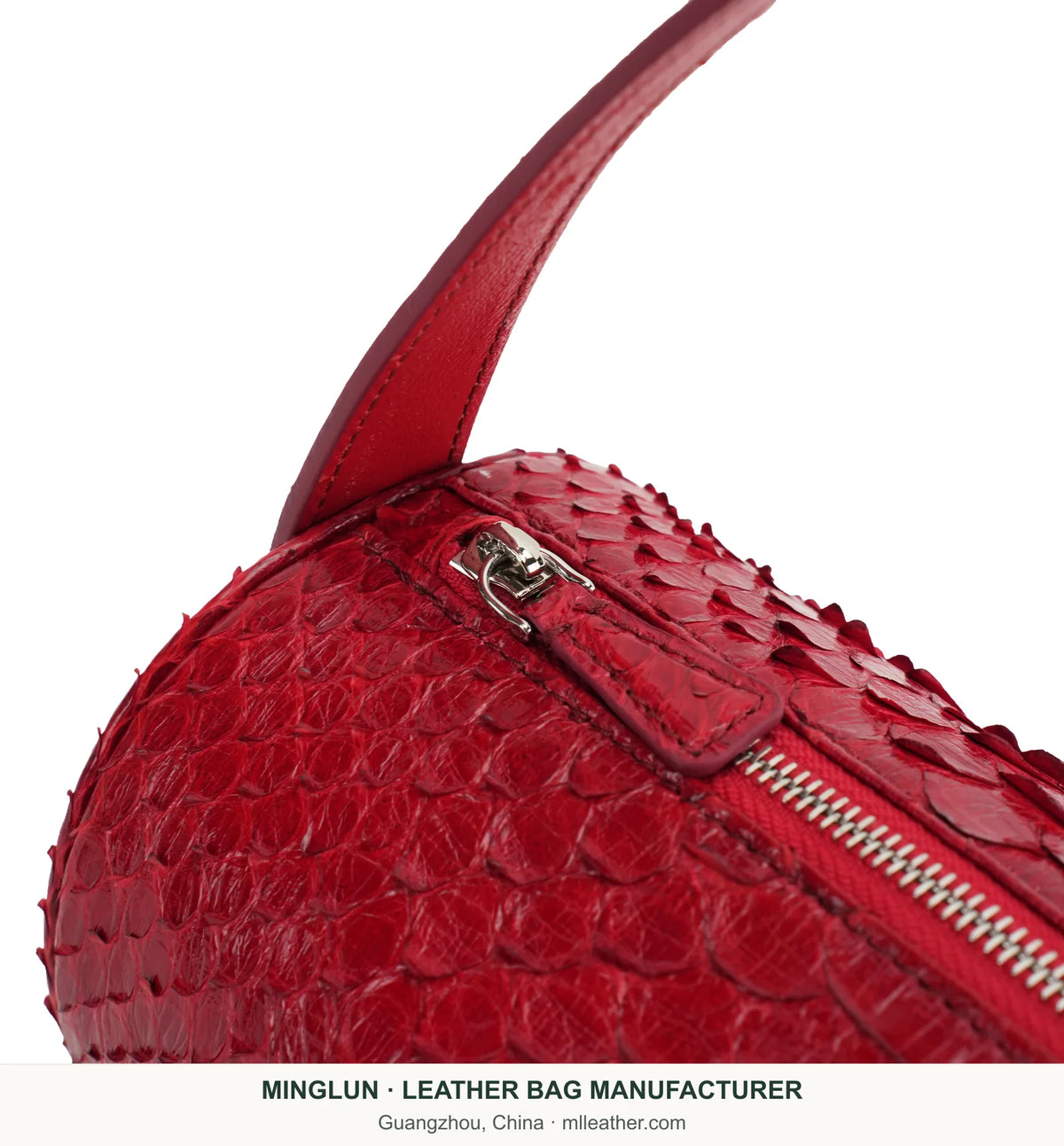 Close-up of red python leather scales, zipper and strap attachment. MINGLUN manufacturer watermark at the bottom.