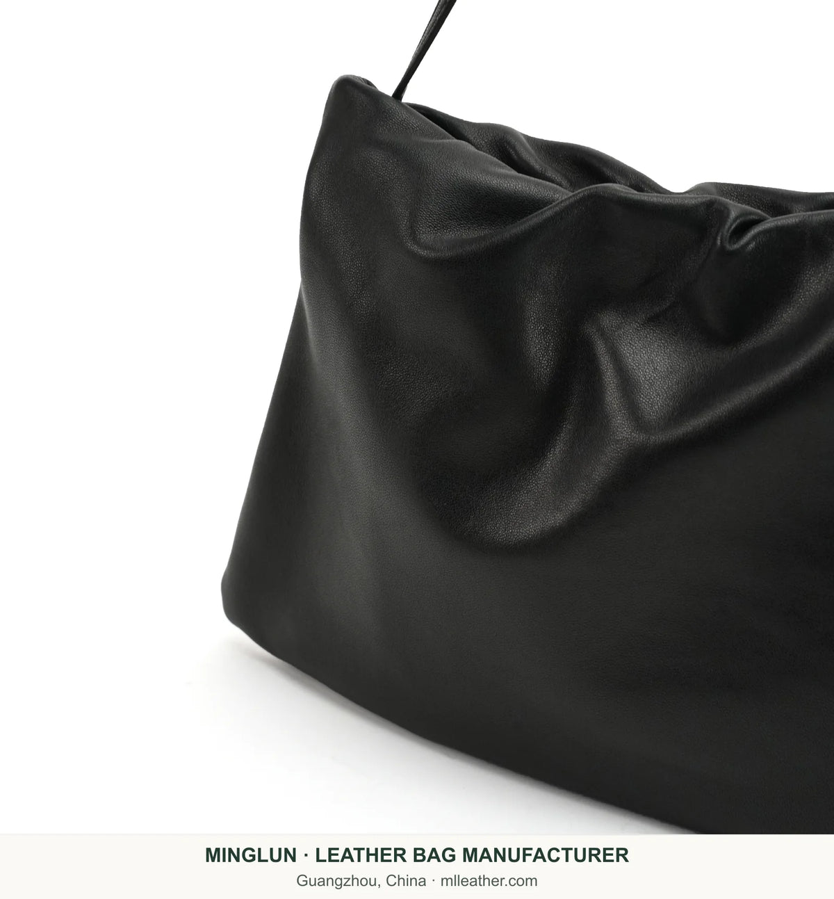 Folded upper edge and side detail on black sheepskin shoulder bag. MINGLUN manufacturer watermark at the bottom.