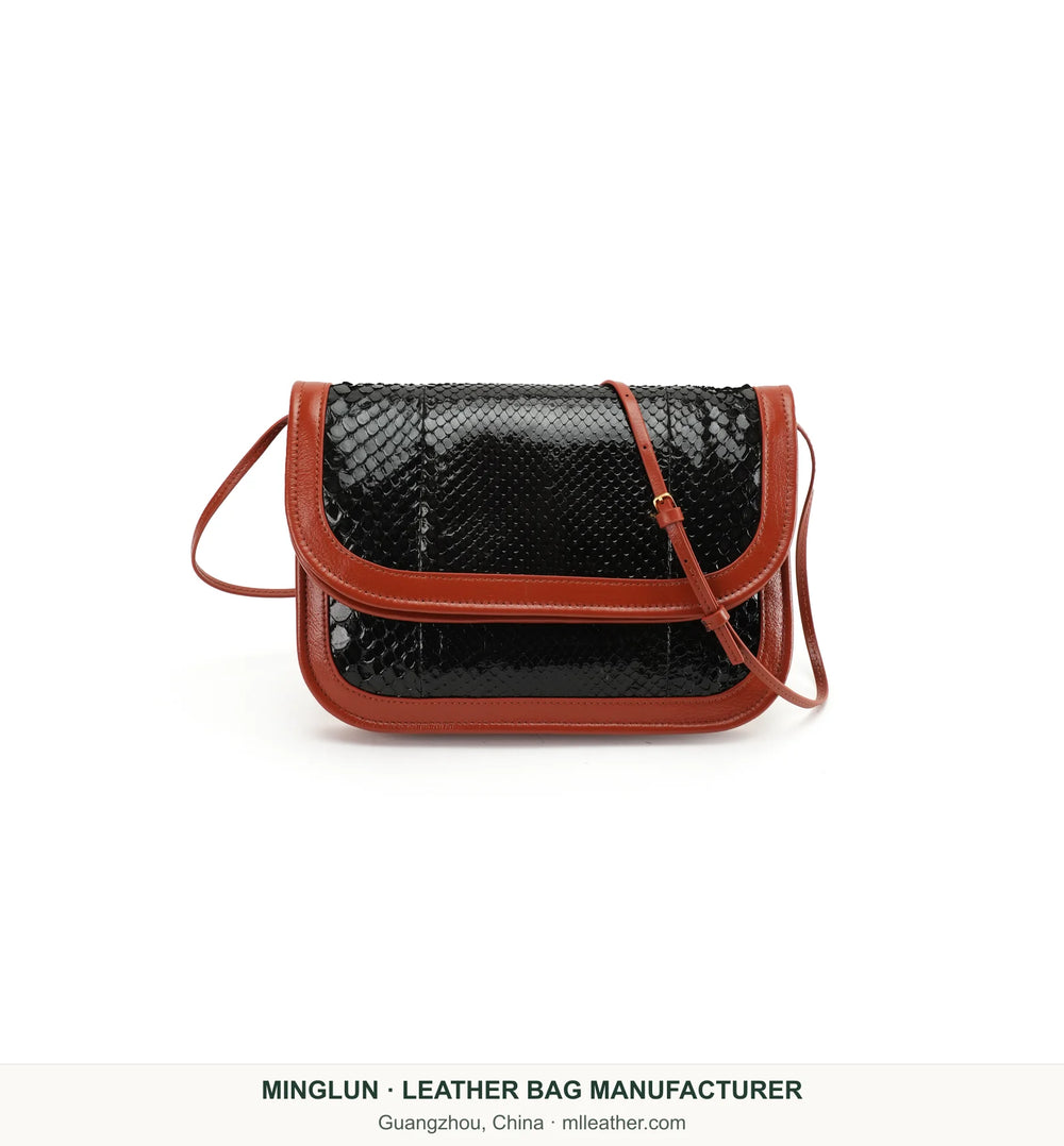 Front view of black snakeskin flap bag with brown trim. MINGLUN manufacturer watermark at the bottom.