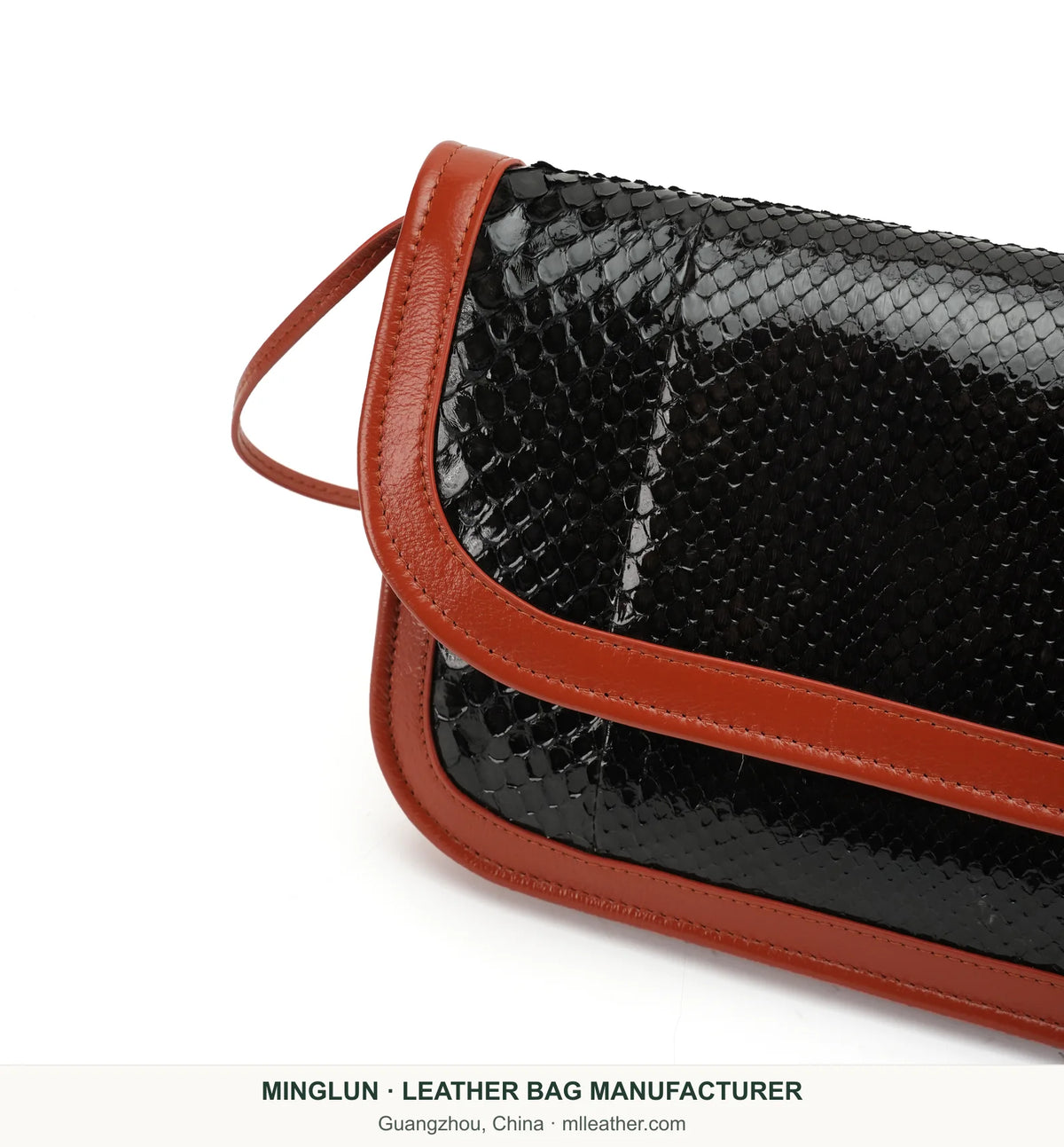 Close-up of black snakeskin flap and brown stitched trim. MINGLUN manufacturer watermark at the bottom.