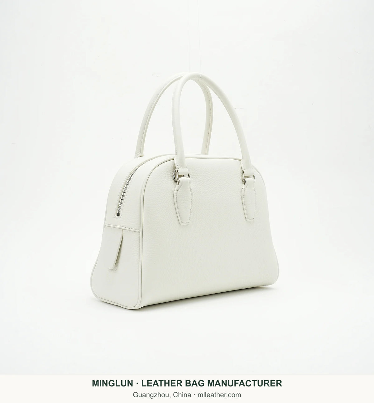Ivory top-grain cowhide bowling bag, three-quarter view. MINGLUN manufacturer watermark at the bottom.