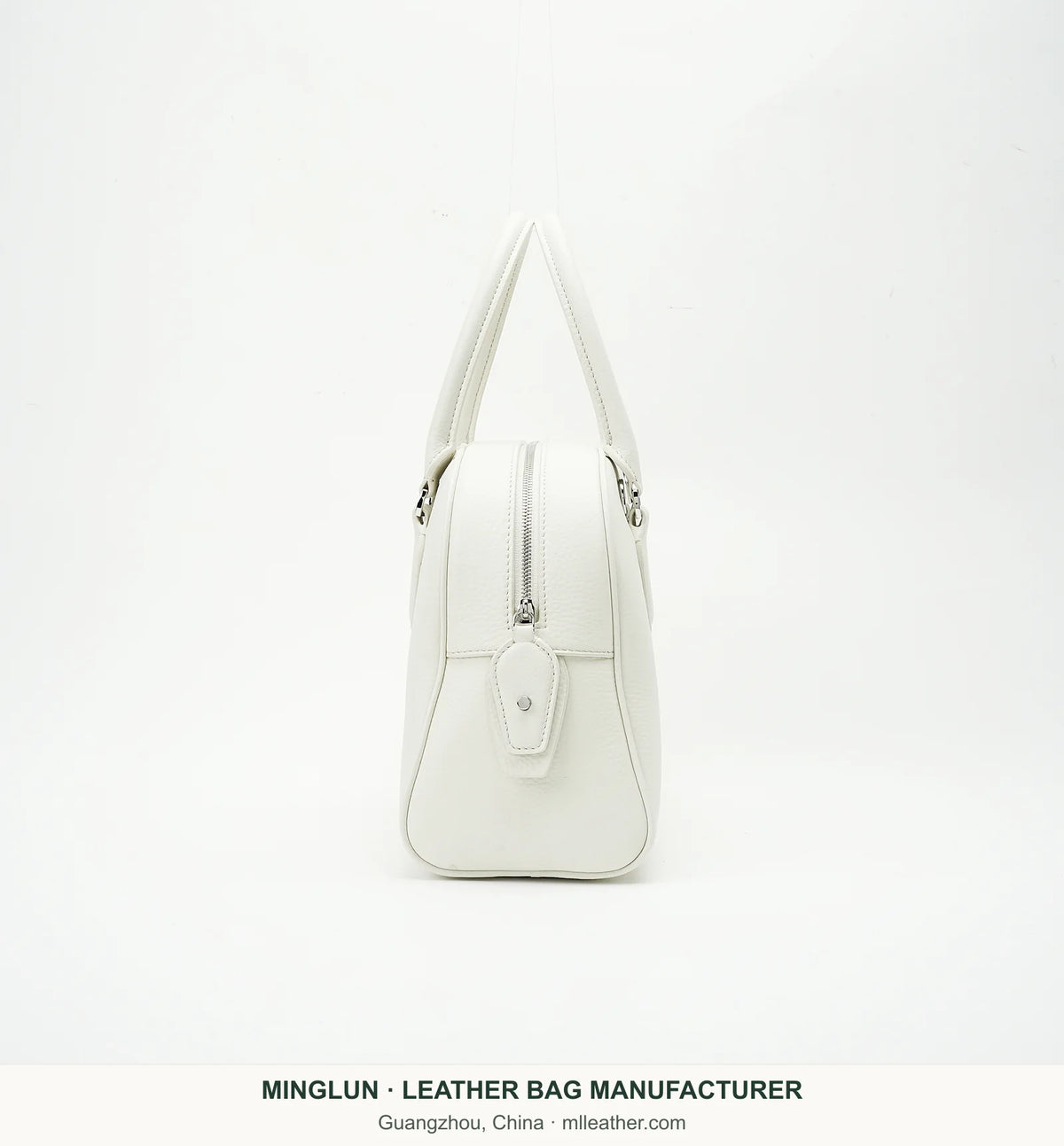 Side view of ivory top-grain cowhide bowling bag showing the zipper. MINGLUN manufacturer watermark at the bottom.