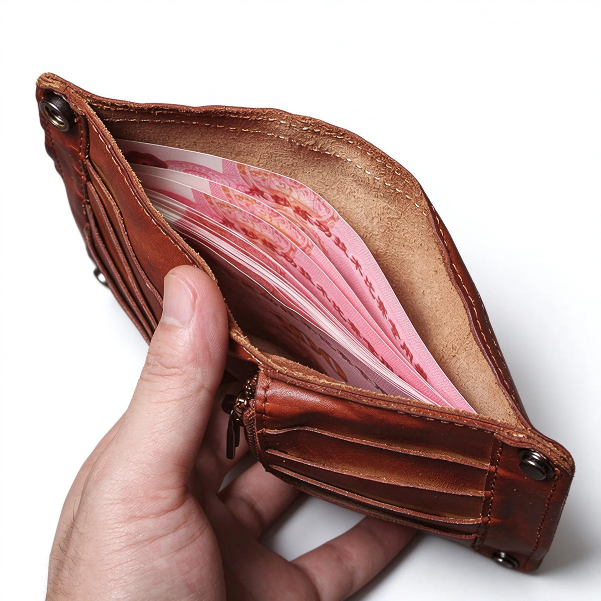 Brown leather wallet held open to show banknotes inside the full-length cash compartment.