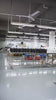 MINGLUN leather handbag production line with finished bags moving through the factory workshop.